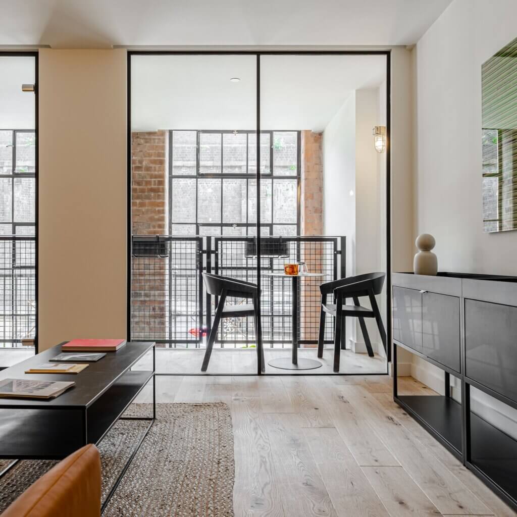 Javelin Block Showroom. Table and chairs on balcony